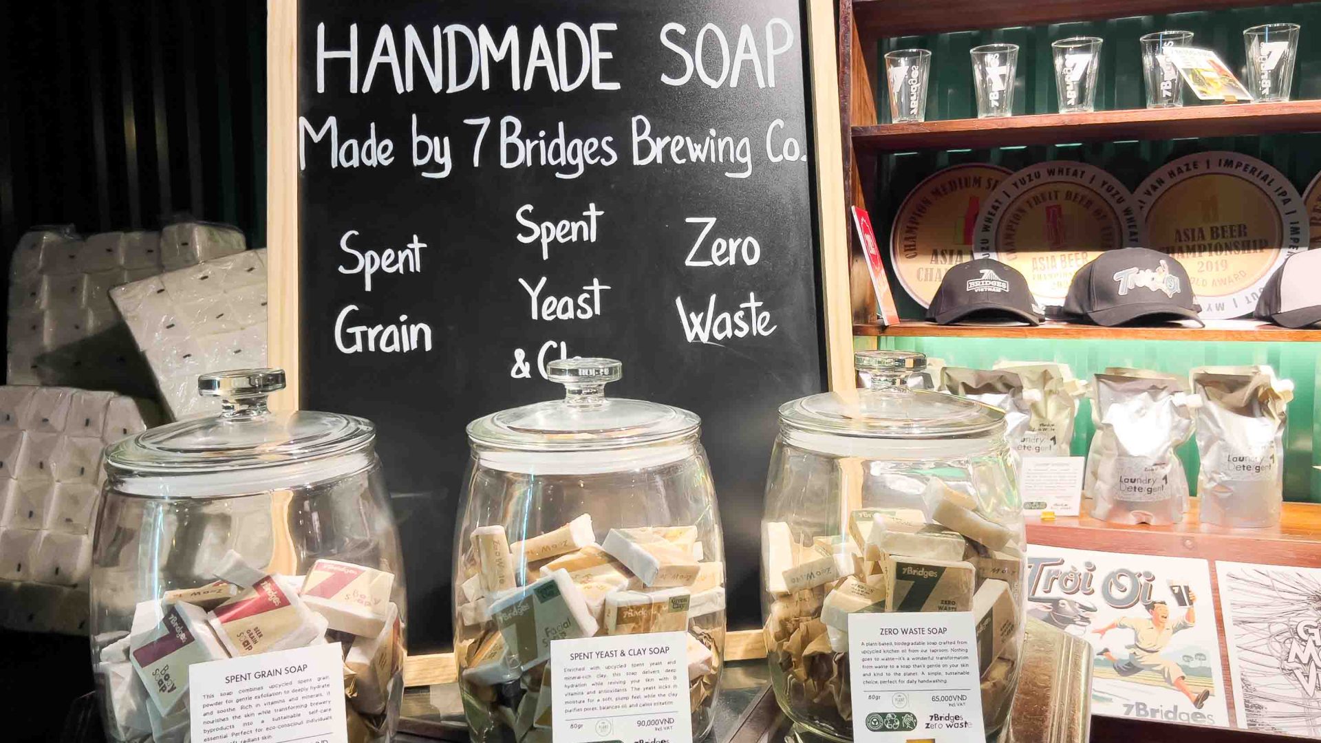 Soap and other products made from beer waste on a display for sale.