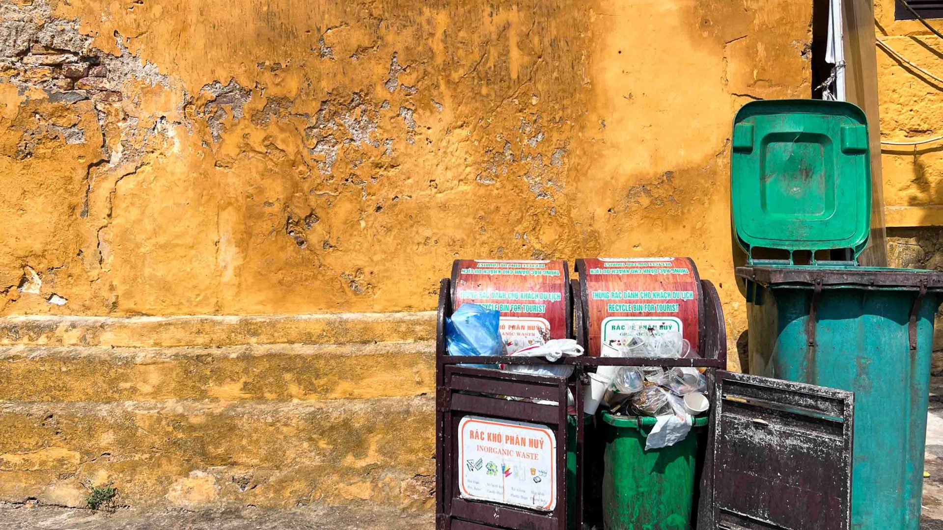 Trash overflows from bins.