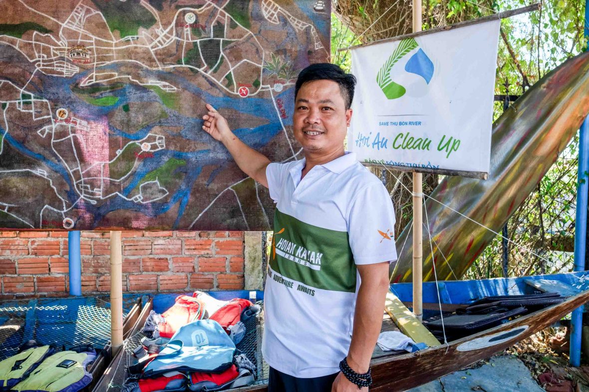 A man points to a map of his kayaking route.