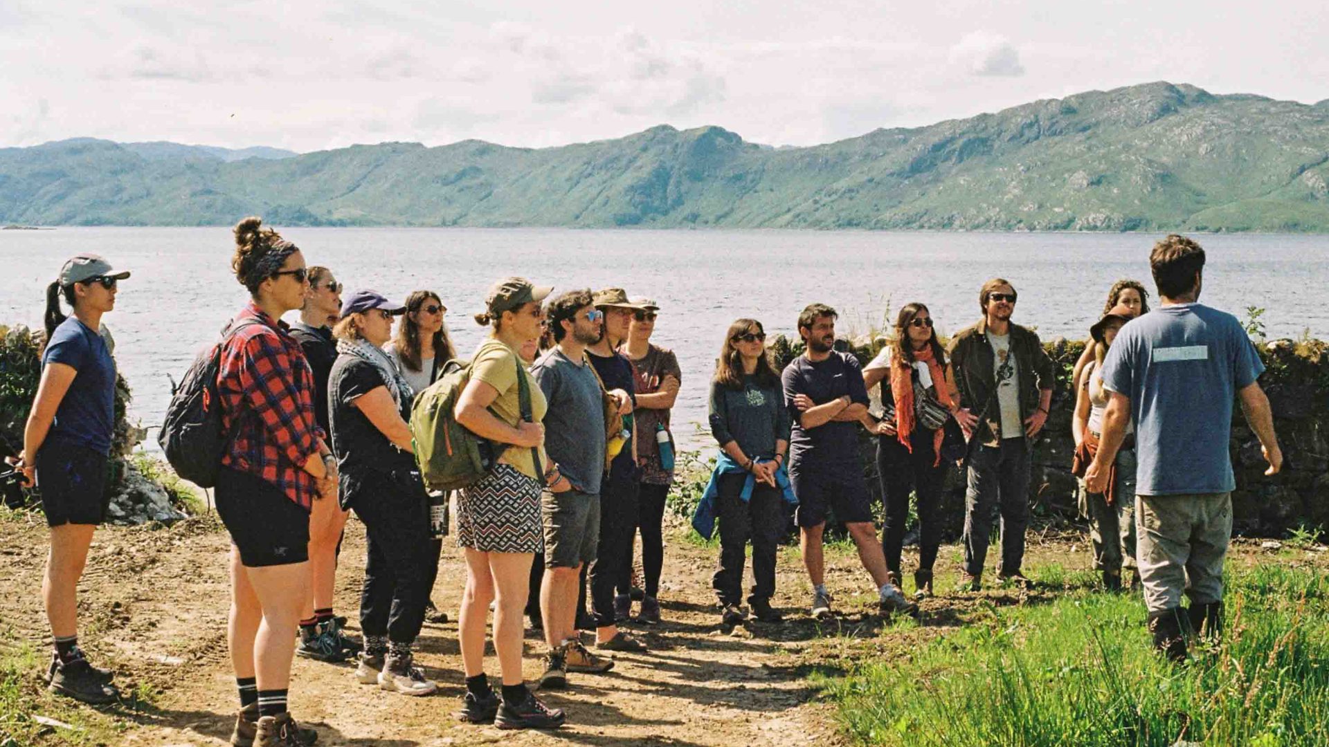 A group listens to a guide.