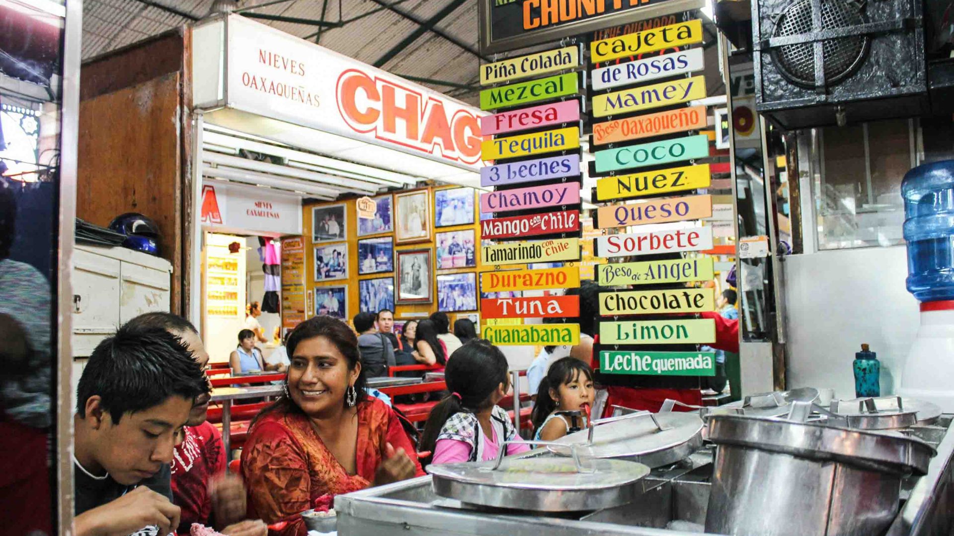 People eat at a market in Oaxaca.