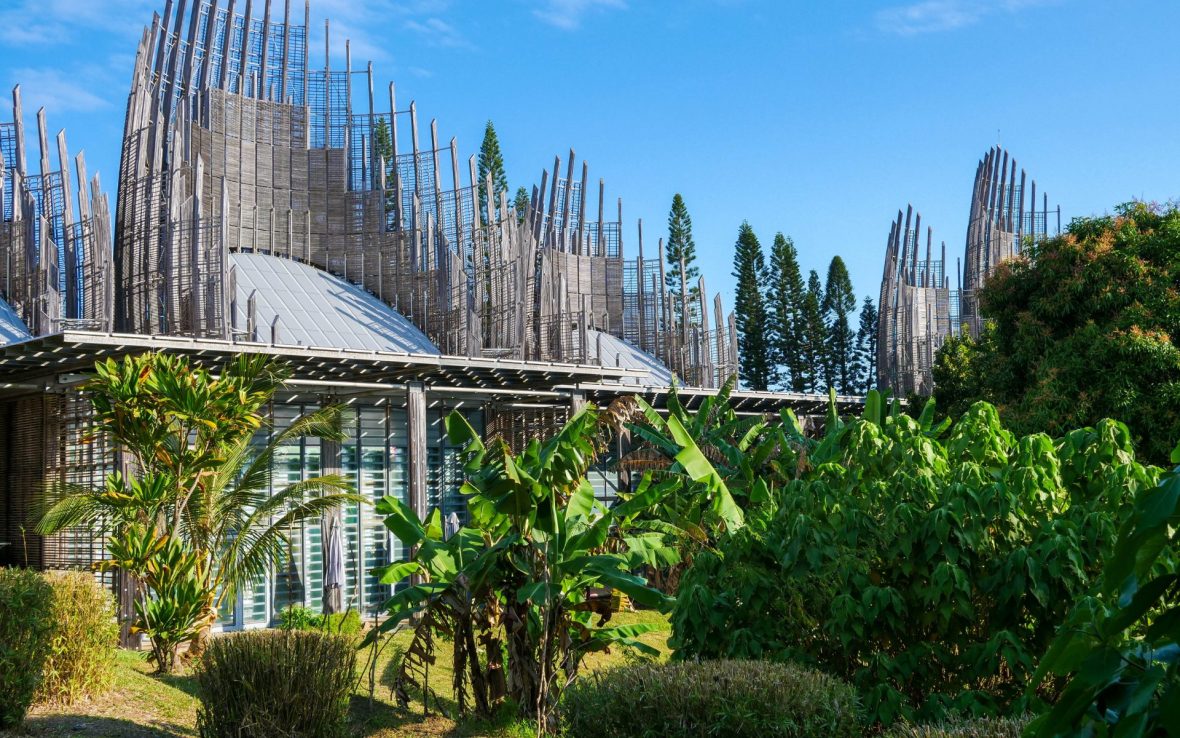 Building set within green jungle.