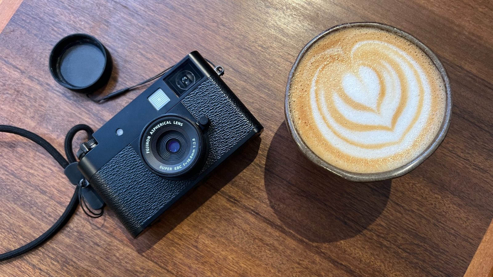 Is this pocket-sized Fuji the perfect travel camera or an overpriced gimmick? 